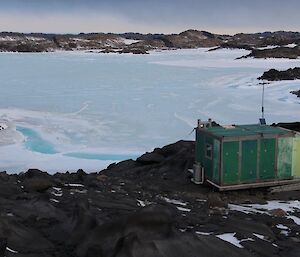 Bandits hut from the back with the high tide water over our tracks coming onto the island