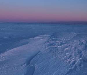 Winter colours in the sky looking out over the plateau towards the coast and Davis