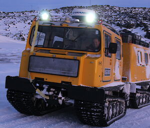 Vas Georgiou and the yellow Hägg drive up the hill from the beach as they arrive back on station