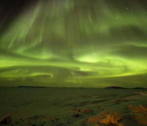 A swirling green aurora over the Bay.