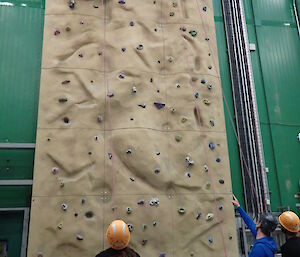 Expeditioners at Davis using the rock climbing wall in the Green store