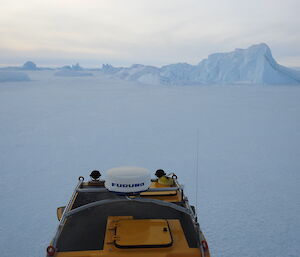 Heading off northeast along the coast across the frozen opcean, the roof hatch is for getting into and out of the Hagglund should it break through the ice into the cold southern ocean