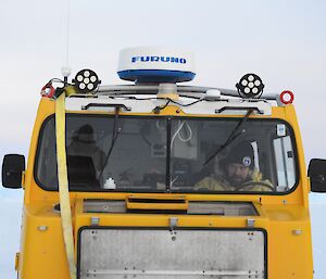 Dr John Parker driving the yellow Hägglunds on the sea ice near Davis station