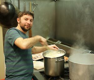 Aaron Stanley assisting in the kitchen for Midwinter feasting preparations
