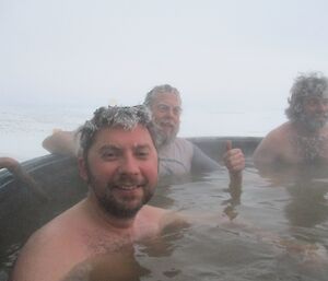 Aaron Stanley, Scott Visser and Chris Burns in the spa at Davis on Midwinters Day