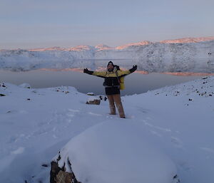 John Parker with arms out-stretched in front of Deep Lake