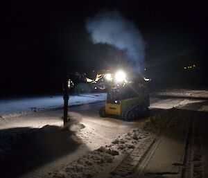 Drilling the first hole in the sea ice in front of Davis Station in preparation for the midwinter swim