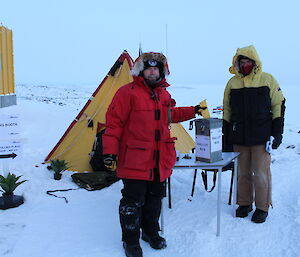 Aaron Stanley the Antarctic Returning Officer posts his vote under the watchful eye of Assistant Antarctic Returning Officer John Parker