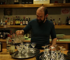 Doctor John Parker pouring a mocktail for a Saturday night celebration at Davis