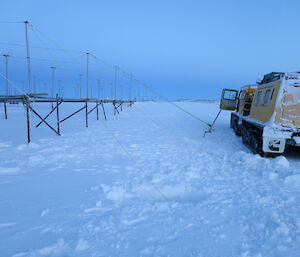 Job done — well almost, the last two guys attached to a pipe in the snow