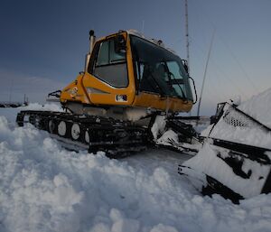 Chris Burns pushing snow after a blizzard at Davis