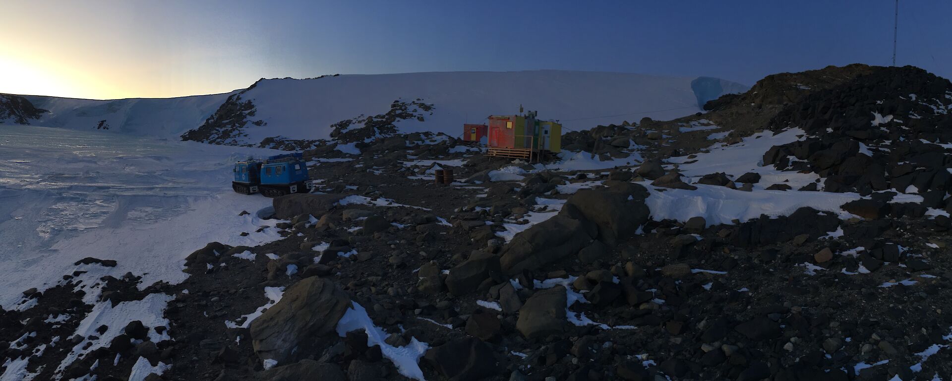 Platcha (new) hut in the foreground and one of the originals in the background and the trusty Hägglunds on the left