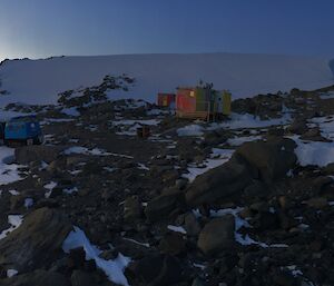 Platcha (new) hut in the foreground and one of the originals in the background and the trusty Hägglunds on the left