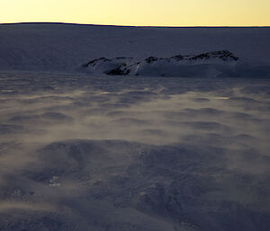 Blowing snow on Long Fjord over sastrugi on the way into Placha
