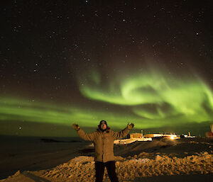 Aaron Stanley with the aurora and Davis in the background