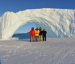 Ladge Kviz, Darren White, John Parker and Ali Dean in front of an impressive iceberg arch