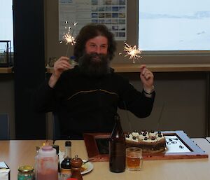 Ladge Kviz holding sparklers for his birthday