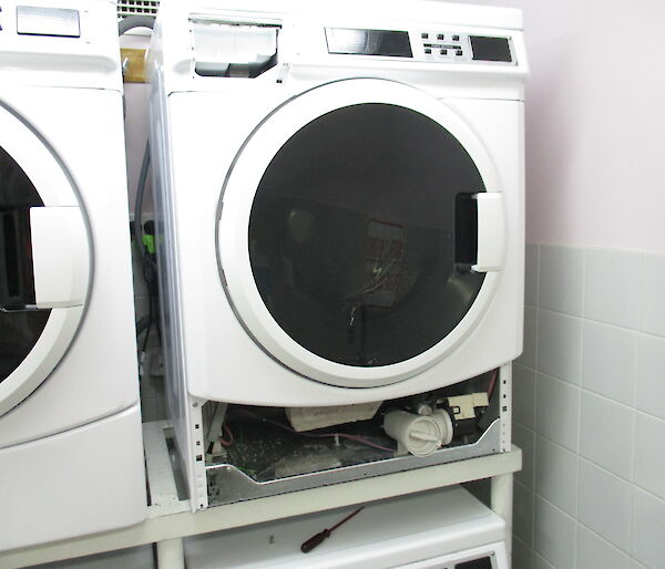 A broken washing machine in the SMQ laundry at Davis