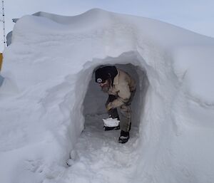 Darren White digging a snow cave