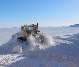 The snow groomer at work outside Davis operations