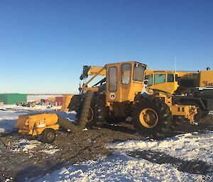 The Herman Nelson machine is like a giant hair dryer, melting out snow from the engine bay of one of the Davis vehicles