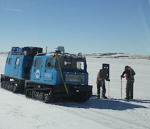 Paul Bright and Michael Goldstein placing flags along the skiway on the Davis sea ice