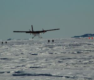 Plane landing on ski landing area