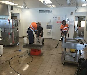 The floor cleaning in the Davis kitchen nearly completed