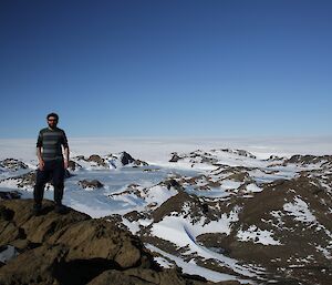 An expeditioner standing on the top of Stalker hill 144 metres, looking towards the ice plateau