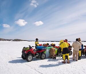 Two quad bikes are facing each other with a small tent-like shelter erected between them, which would be emergency shelter if required.