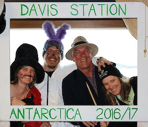 Louise dressed as a magician, Ralph as a bunny, Richard as a reporter and Anna as an activist, posing for a photo.