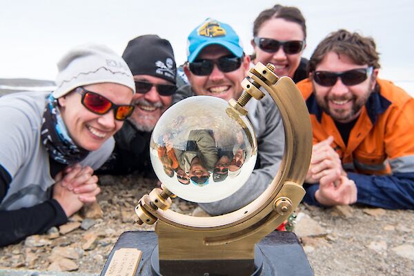 Daleen, Barry, Damo, Rachel and Aaron are lying in a half circle, on the ground, looking at the sunshine recorder. This device looks like a hybrid between a sextant and a crystal ball.