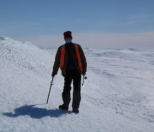 Lotter is standing on the side of an ice blister, near Channel Lake on the Sørsdal glacier.