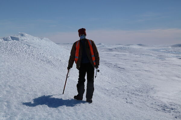 Lotter is standing on the side of an ice blister, near Channel Lake on the Sørsdal glacier.