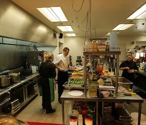 The three station chefs (Kerryn, Arvid and Lesley) are all working in the kitchen, preparing Christmas lunch.