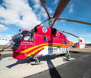 A close up of the Kamov helicopter. With its two rotors, skis and bus like bulk, used to lift heavy loads and transport lots of people.