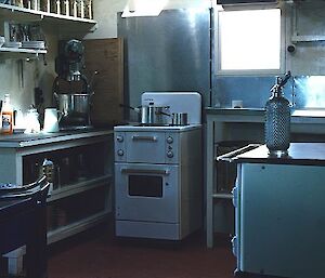 A new stove can be seen in the kitchen. Photo taken in 1957.