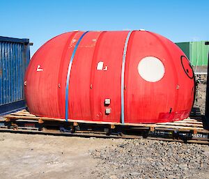 The melon sits in a open sided shipping container, ready for return to Australia on the ship in February.