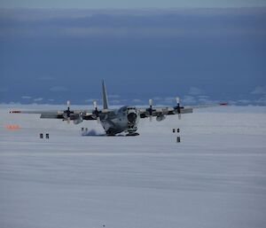 The hercules plane lands on it’s ski’s on the ice skiway.