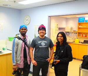 Our doctor, Ralph, is standing between the two Indian doctors, inside his medical clinic. They are on a station tour.