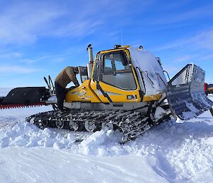 Jock removing batteries from the snow grooming machine.