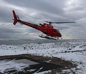The final helicopter flight of the season. It has just taken off from the Davis helipad and is heading for the ship.
