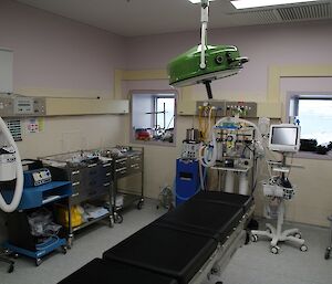 The operating theatre with a table for the patient and lots and lots of medical equipment!