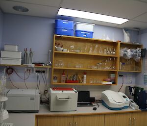 The medical lab on station containing numberous machines for testing samples, and lots of chemistry glassware.