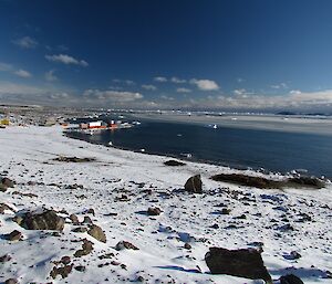 A view of the Davis beach with a thin layer of sea-ice out in the middle of the bay.