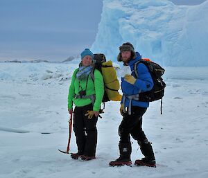 Kerryn and Bryce are out on the sea-ice enjoying a walk. In the distance is an iceberg frozen into the sea-ice.