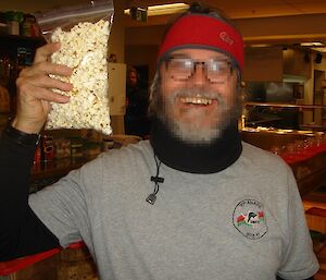 Patient X with a bag of popcorn after his dental work.