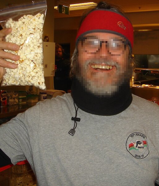 Patient X with a bag of popcorn after his dental work.