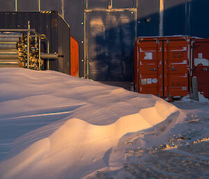 A tongue of snow extends towards the door of the Power House.