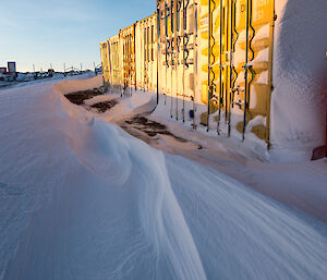 A wind scour around the shipping containers.